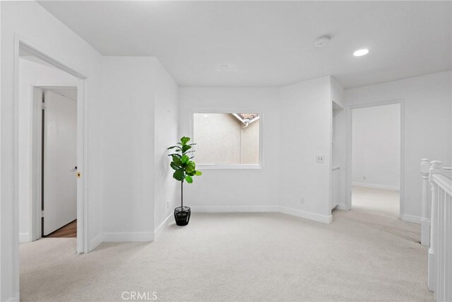unfurnished room with recessed lighting, carpet flooring, and baseboards