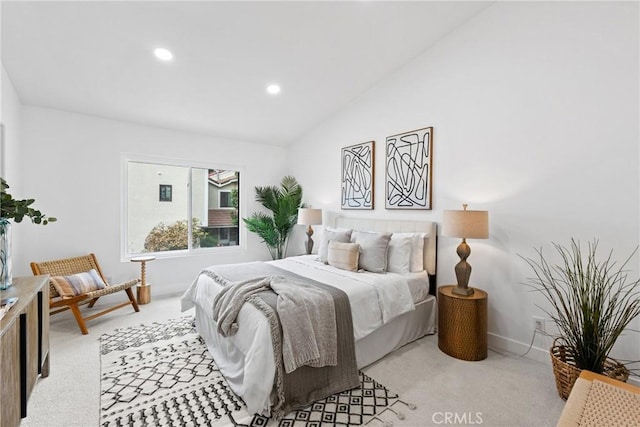 bedroom featuring light colored carpet, lofted ceiling, recessed lighting, and baseboards