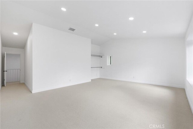 unfurnished room featuring light carpet, visible vents, and recessed lighting