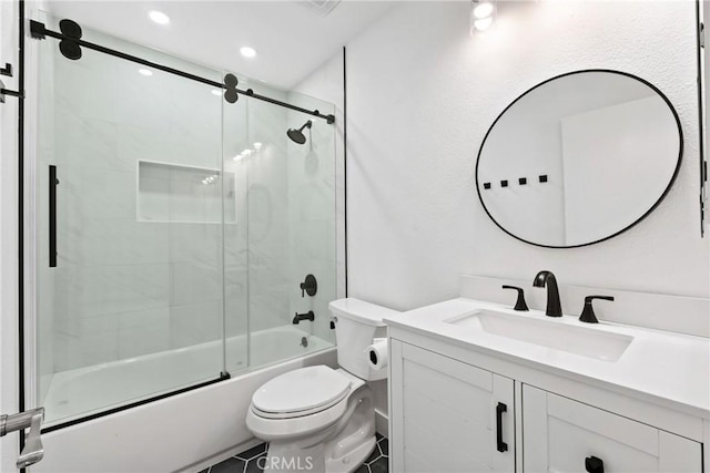 bathroom featuring vanity, recessed lighting, shower / bath combination with glass door, and toilet