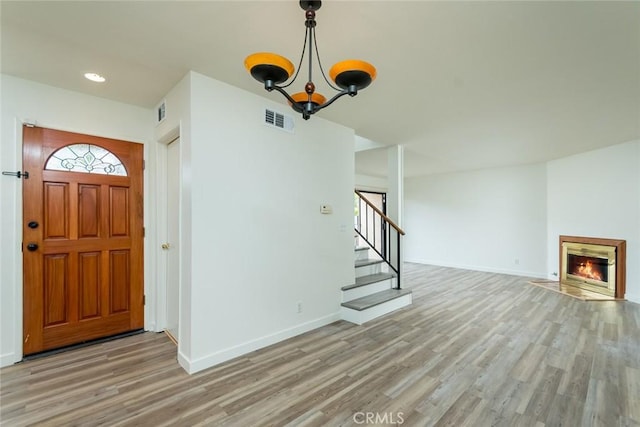 527 E Elmwood Ave Unit E, Burbank, CA 91501 - entryway with baseboards, visible vents, stairs, and light wood finished floors