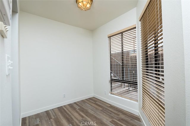 527 E Elmwood Ave Unit E, Burbank, CA 91501 - spare room with baseboards and wood finished floors
