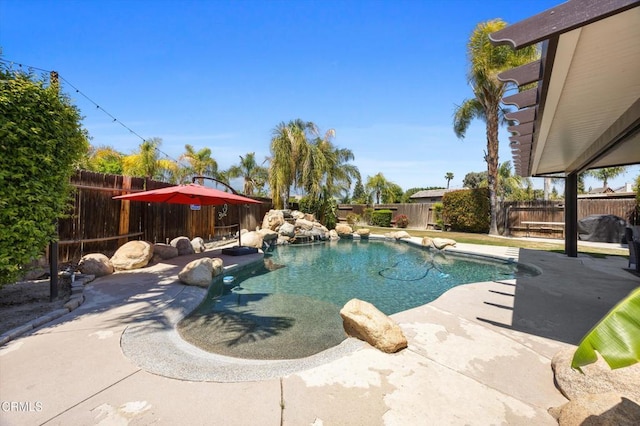 view of swimming pool featuring a fenced backyard, a patio, and a fenced in pool