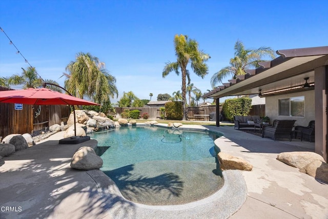 view of swimming pool with a fenced backyard, outdoor lounge area, a fenced in pool, and a patio