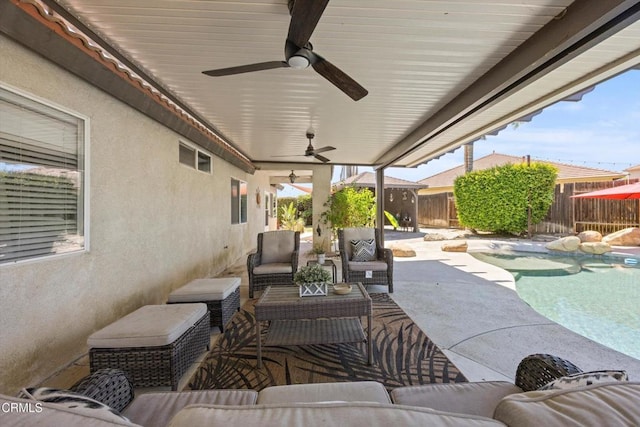 view of patio / terrace featuring ceiling fan, a fenced backyard, outdoor lounge area, and a fenced in pool