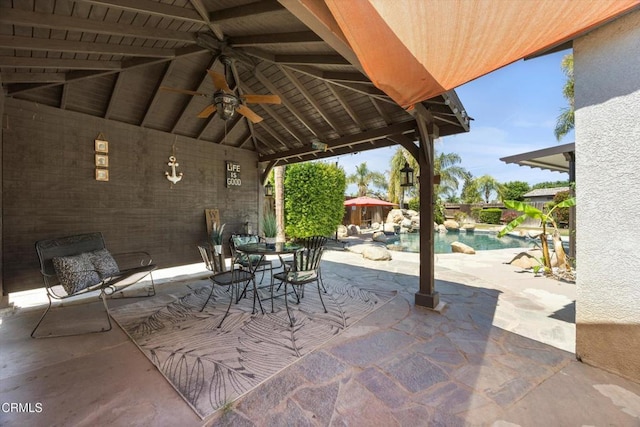view of patio with a gazebo, an outdoor pool, and ceiling fan