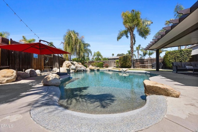 view of pool featuring a fenced in pool, a patio, and a fenced backyard