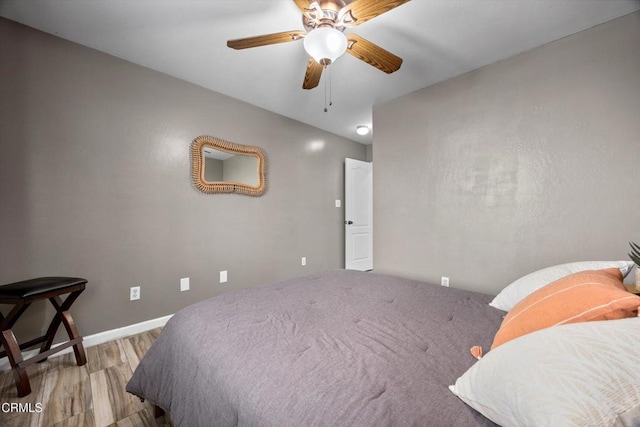 bedroom featuring a ceiling fan and wood finished floors