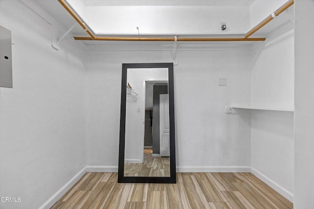 spacious closet with wood finished floors