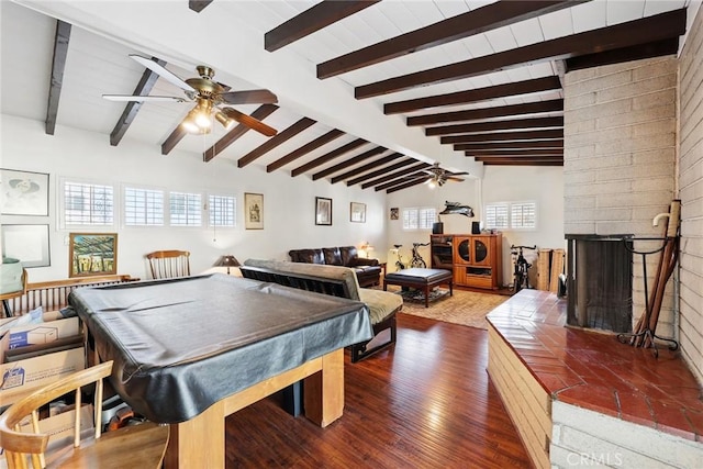 game room featuring vaulted ceiling with beams, a brick fireplace, wood finished floors, billiards, and ceiling fan