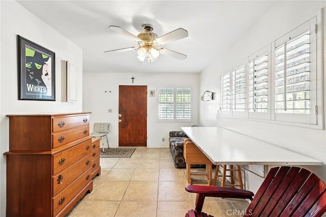 dining room with light tile patterned flooring and ceiling fan