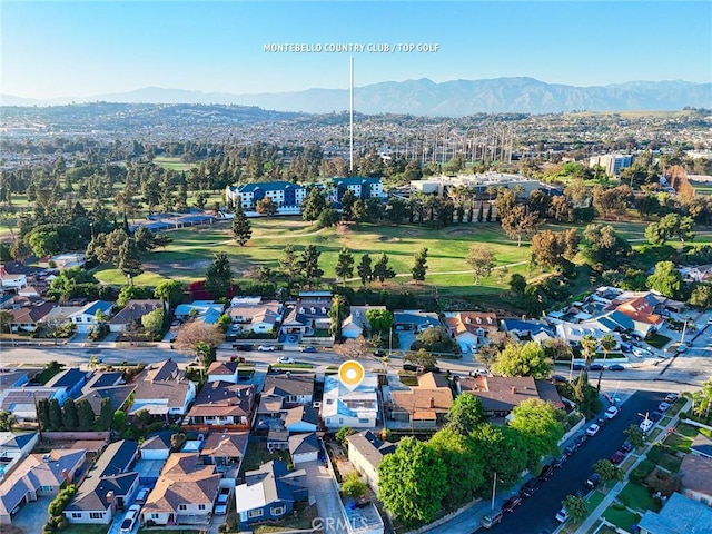 birds eye view of property featuring a residential view, a mountain view, and view of golf course