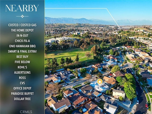 birds eye view of property with a residential view and a mountain view