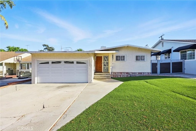 single story home featuring stucco siding, an attached garage, driveway, and a front lawn