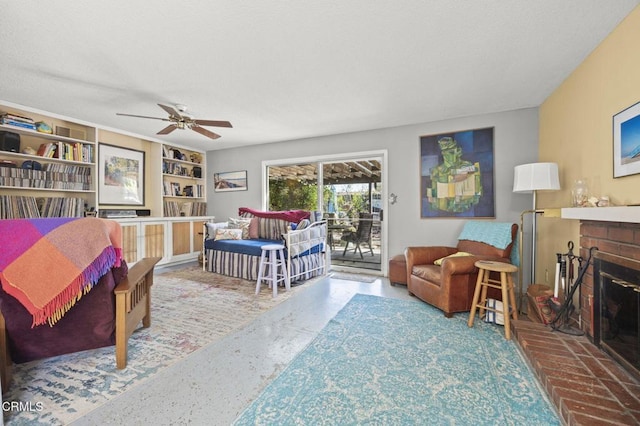 bedroom featuring a fireplace, a textured ceiling, a ceiling fan, and access to outside