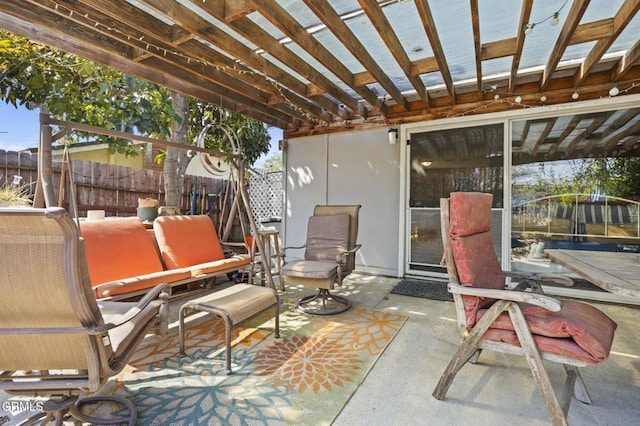 view of patio featuring fence