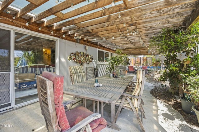 view of patio / terrace with a pergola and outdoor dining space