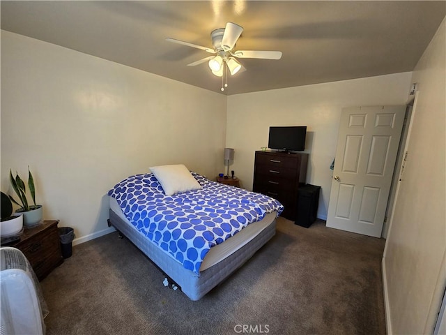 carpeted bedroom with baseboards and ceiling fan