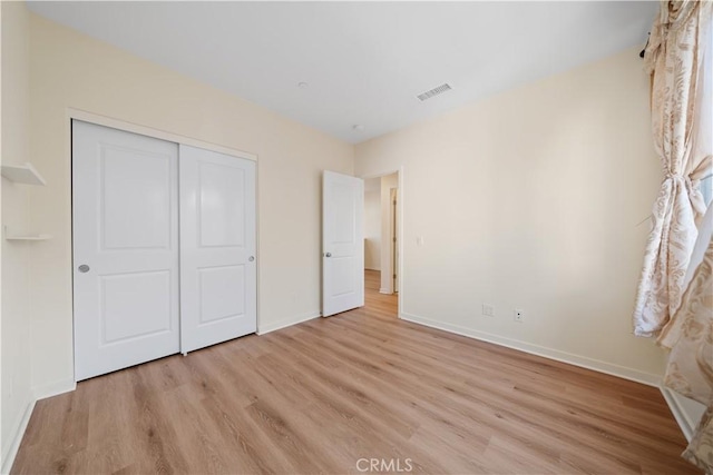 111 Messenger, Irvine, CA 92618 - unfurnished bedroom featuring baseboards, light wood finished floors, visible vents, and a closet