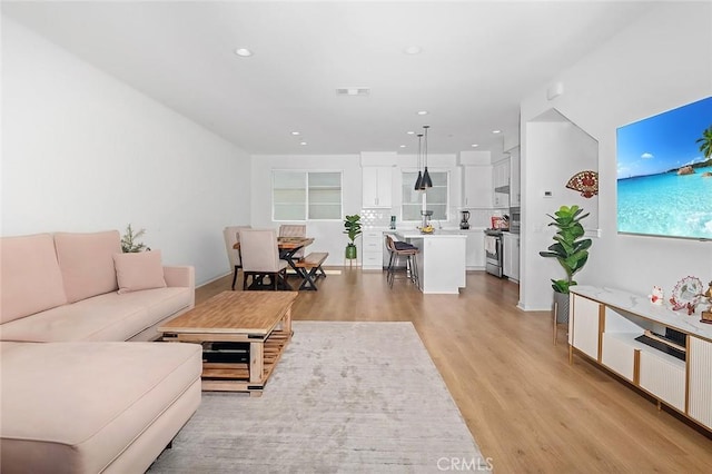 208 Novel, Irvine, CA 92618 - living area with light wood finished floors and recessed lighting