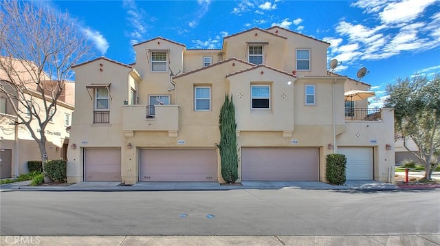 44936 Honey Locust Dr, Temecula, CA 92592 - view of property with stucco siding and an attached garage