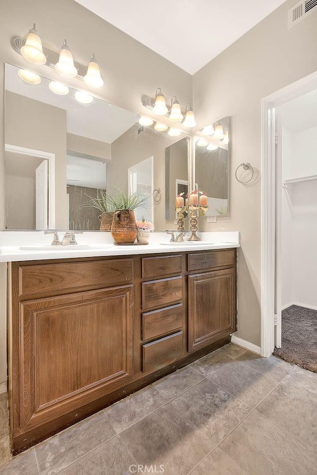 44936 Honey Locust Dr, Temecula, CA 92592 - full bath featuring a sink, double vanity, visible vents, and tile patterned flooring