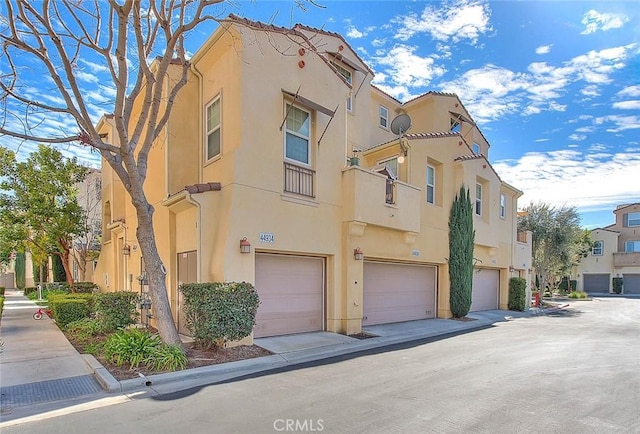 44936 Honey Locust Dr, Temecula, CA 92592 - view of building exterior featuring a residential view and a garage