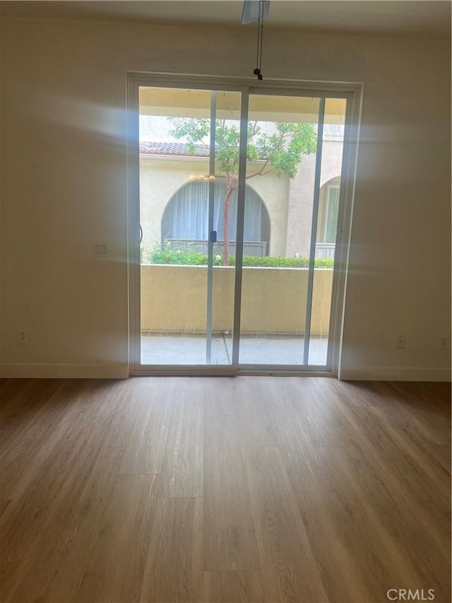 44936 Honey Locust Dr, Temecula, CA 92592 - empty room with wood finished floors and baseboards