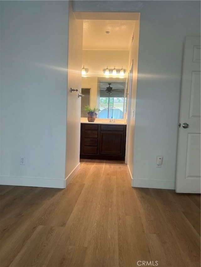 44936 Honey Locust Dr, Temecula, CA 92592 - corridor with baseboards and light wood-style floors