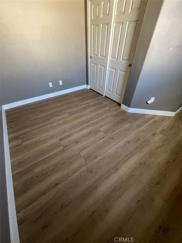 44936 Honey Locust Dr, Temecula, CA 92592 - unfurnished bedroom featuring baseboards, wood finished floors, and a closet