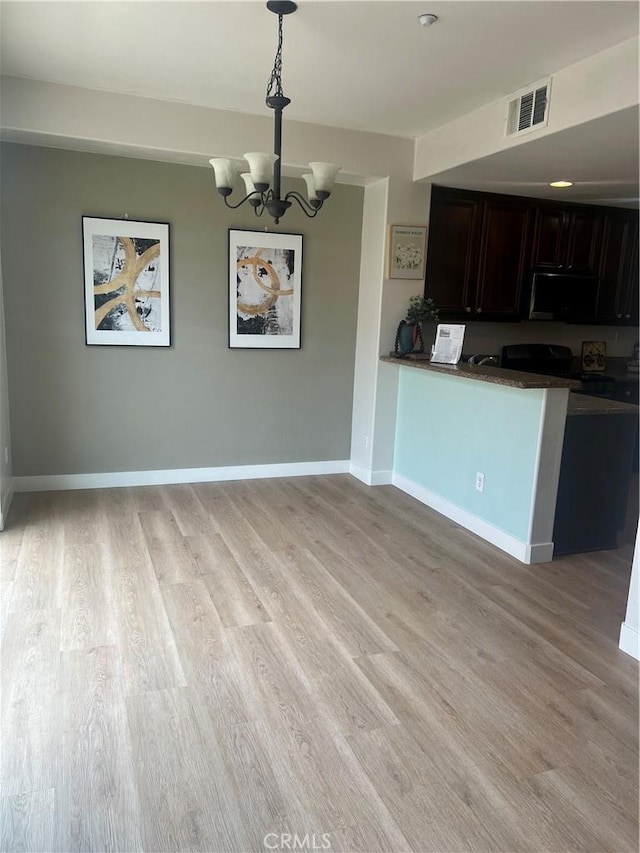 44936 Honey Locust Dr, Temecula, CA 92592 - unfurnished dining area featuring visible vents, light wood-type flooring, a chandelier, and baseboards