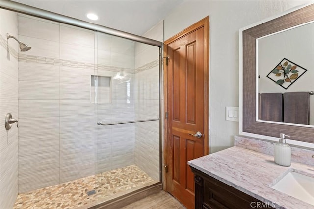 27363 Matterhorn Dr, Lake Arrowhead, CA 92352 - bathroom with recessed lighting, vanity, and a stall shower