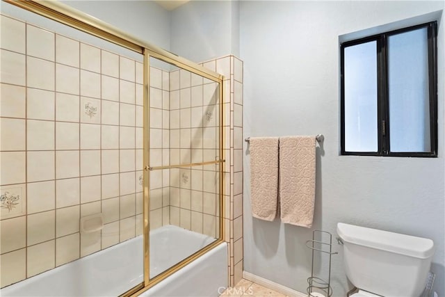 27363 Matterhorn Dr, Lake Arrowhead, CA 92352 - bathroom featuring toilet and bath / shower combo with glass door