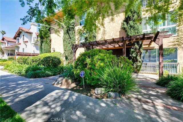 120 S Sierra Madre Blvd Unit 206, Pasadena, CA 91107 - view of side of home featuring a pergola and stucco siding