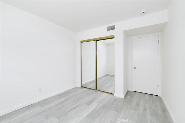 120 S Sierra Madre Blvd Unit 206, Pasadena, CA 91107 - unfurnished bedroom featuring wood finished floors, a closet, and baseboards