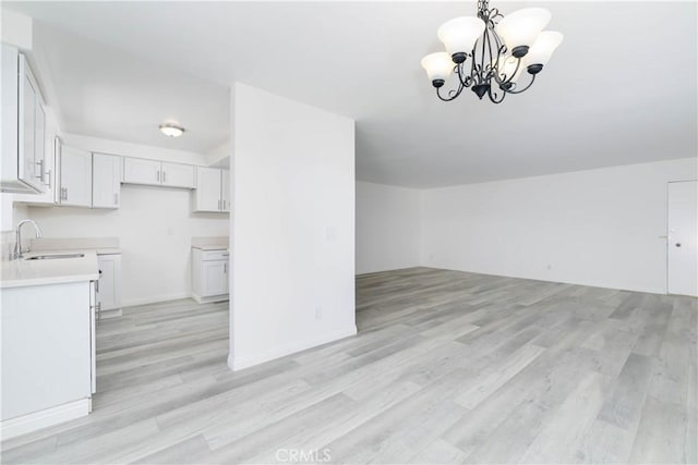 120 S Sierra Madre Blvd Unit 206, Pasadena, CA 91107 - bonus room featuring a sink, light wood-style floors, and a chandelier