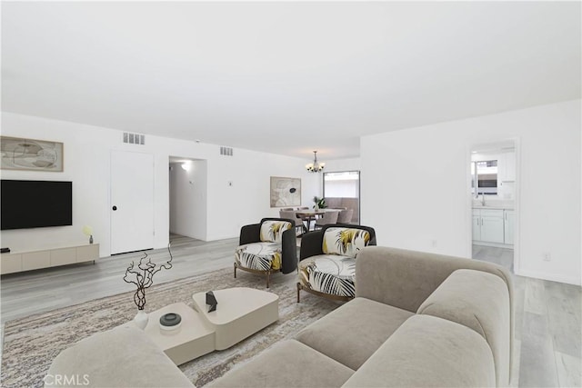 120 S Sierra Madre Blvd Unit 206, Pasadena, CA 91107 - living area featuring wood finished floors and a chandelier