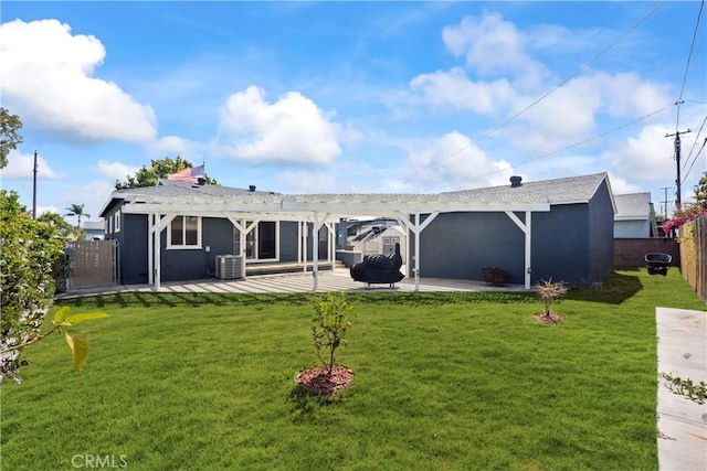 back of property with a pergola, central AC unit, and a patio area