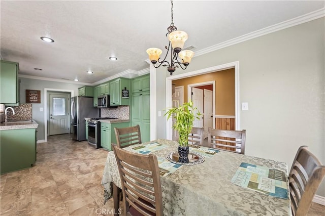 dining space featuring ornamental molding, recessed lighting, a chandelier, and baseboards