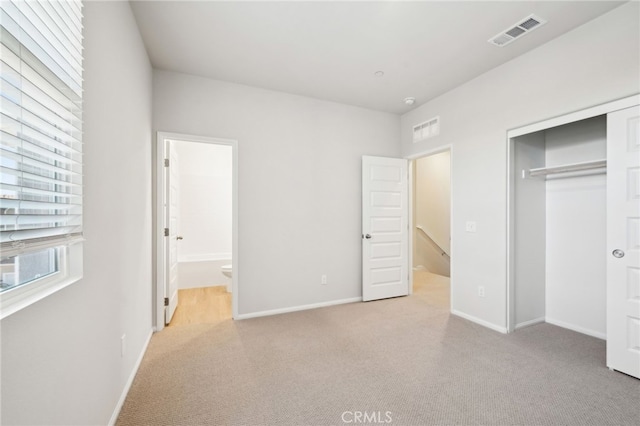 219 Aurora Ln, Pomona, CA 91767 - unfurnished bedroom featuring carpet, a closet, baseboards, and connected bathroom