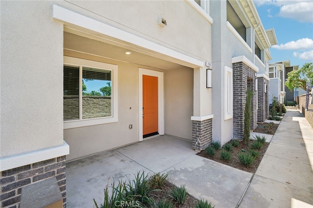 219 Aurora Ln, Pomona, CA 91767 - view of exterior entry with stucco siding