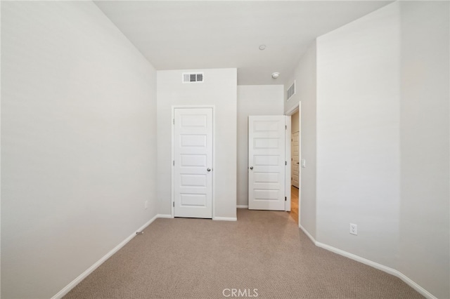 219 Aurora Ln, Pomona, CA 91767 - unfurnished bedroom featuring light colored carpet and baseboards