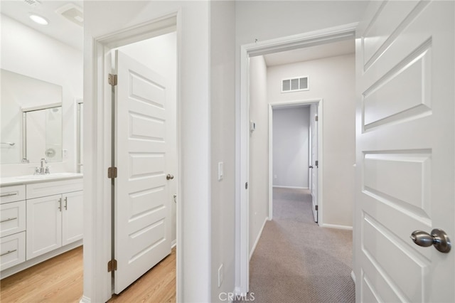 219 Aurora Ln, Pomona, CA 91767 - hallway with a sink and baseboards