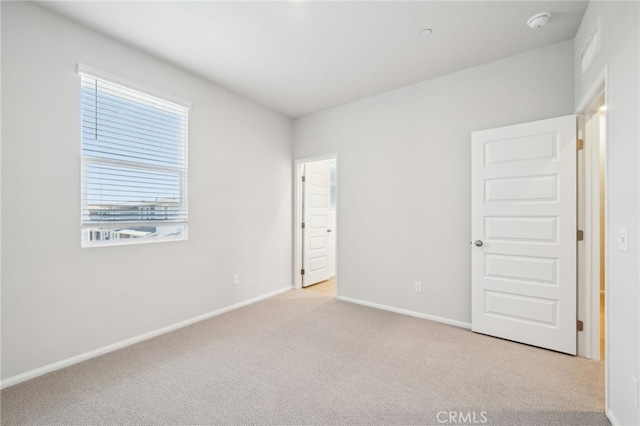 219 Aurora Ln, Pomona, CA 91767 - unfurnished bedroom featuring carpet floors and baseboards