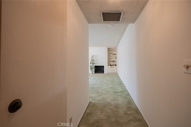 999 E Valley Blvd Unit 44, Alhambra, CA 91801 - corridor featuring carpet flooring, a textured ceiling, and built in features