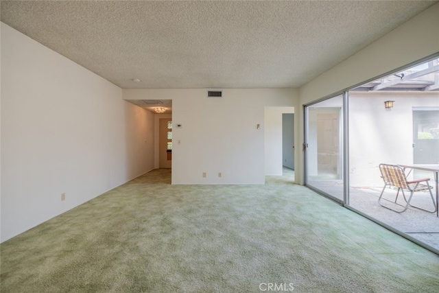 999 E Valley Blvd Unit 44, Alhambra, CA 91801 - spare room featuring light carpet and a textured ceiling