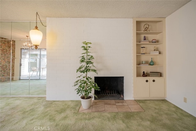999 E Valley Blvd Unit 44, Alhambra, CA 91801 - unfurnished living room with carpet, built in features, a fireplace, a chandelier, and a textured ceiling