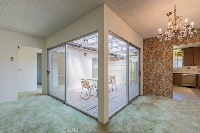 999 E Valley Blvd Unit 44, Alhambra, CA 91801 - doorway with light carpet, a textured ceiling, and a chandelier