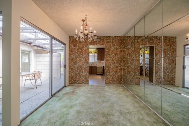 999 E Valley Blvd Unit 44, Alhambra, CA 91801 - unfurnished dining area featuring a chandelier, carpet, and a textured ceiling