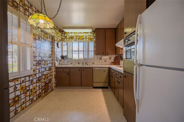 999 E Valley Blvd Unit 44, Alhambra, CA 91801 - kitchen featuring freestanding refrigerator, dishwashing machine, tile counters, a sink, and oven